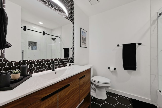 bathroom featuring vanity, a shower with shower door, decorative backsplash, and toilet