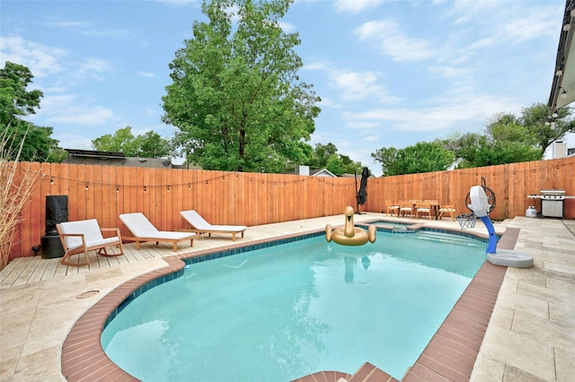 view of pool featuring an in ground hot tub and a patio area