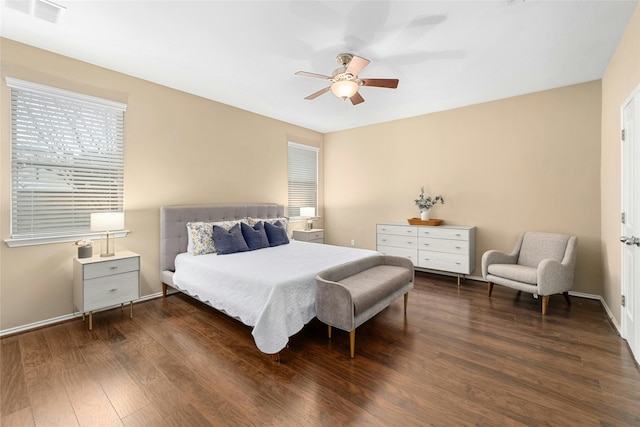 bedroom featuring ceiling fan and dark hardwood / wood-style floors