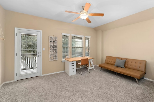 office space featuring ceiling fan, a wealth of natural light, and light carpet