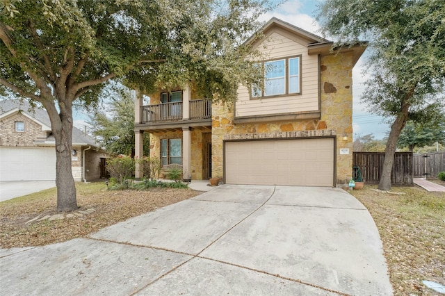 view of front of property with a balcony and a garage