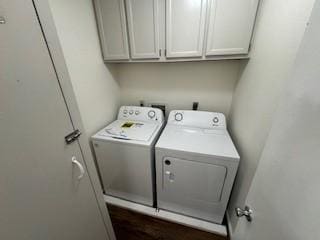 laundry room featuring cabinets and washer and dryer