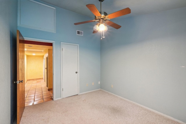 unfurnished bedroom with carpet floors and ceiling fan