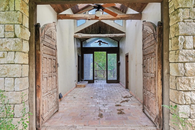 entrance to property featuring ceiling fan