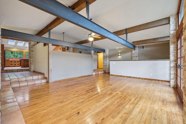 unfurnished living room with ceiling fan, light hardwood / wood-style flooring, beam ceiling, and high vaulted ceiling