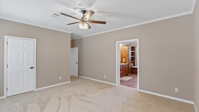 unfurnished bedroom with light carpet, connected bathroom, ceiling fan, and ornamental molding