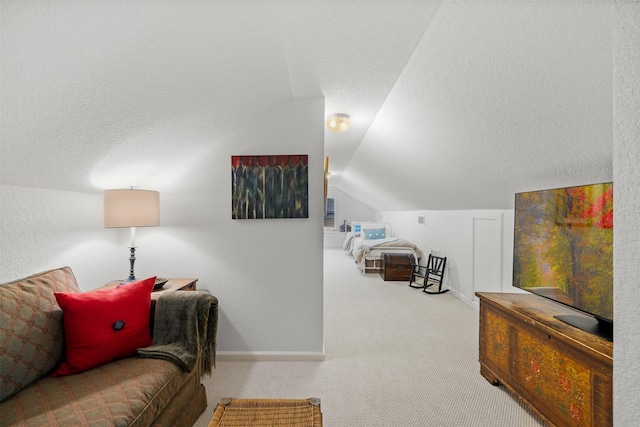 living room with light colored carpet, a textured ceiling, and vaulted ceiling