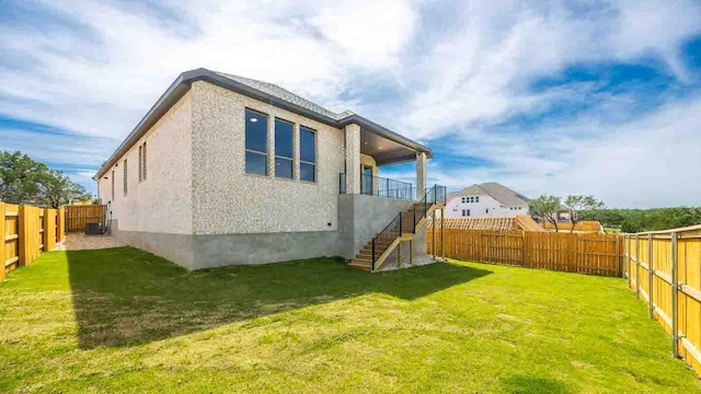 back of property featuring stairway