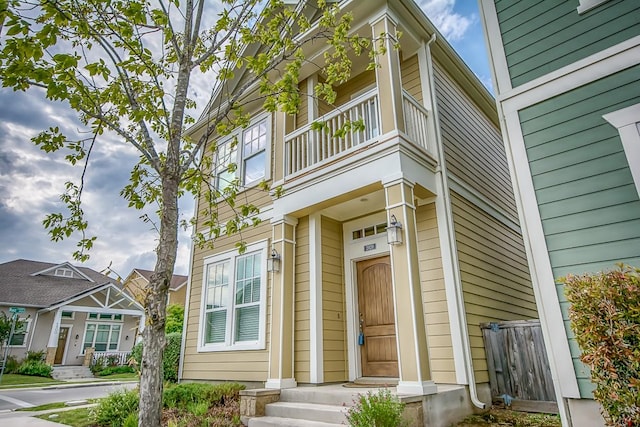 entrance to property with a balcony