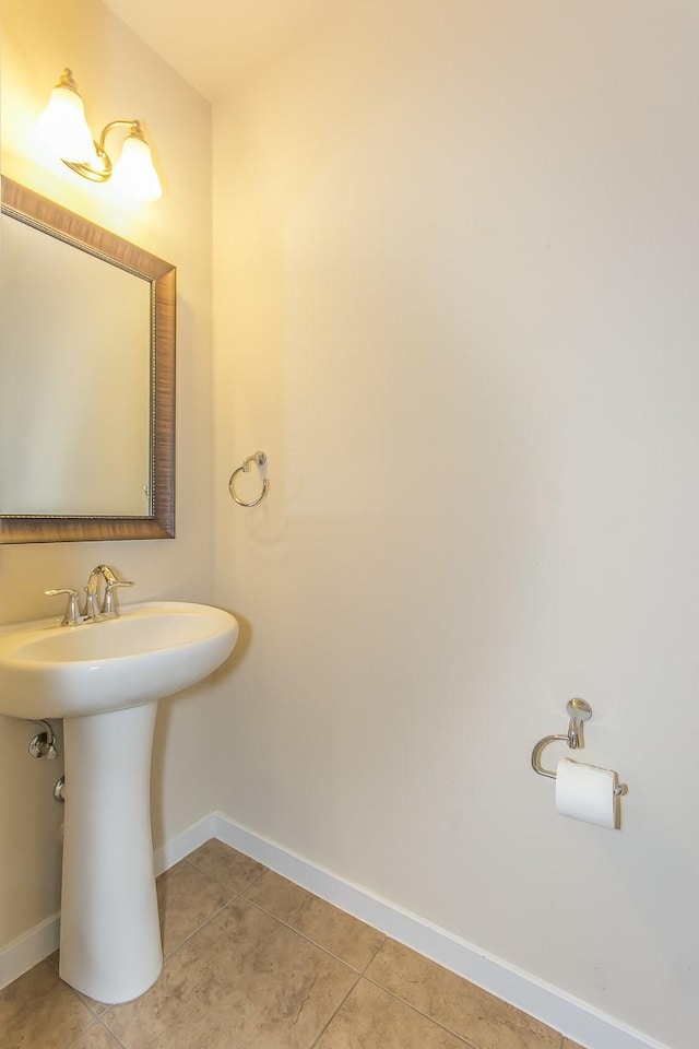 bathroom with sink and tile patterned flooring