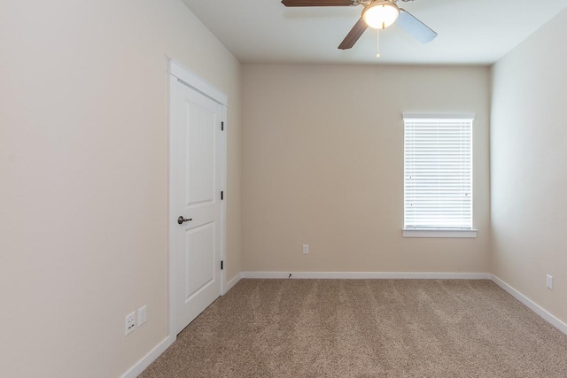 empty room with carpet floors and ceiling fan