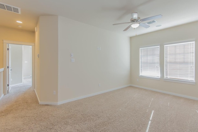 carpeted empty room featuring ceiling fan