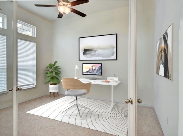 home office featuring ceiling fan, light colored carpet, and french doors