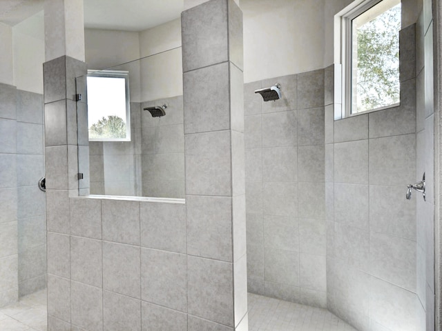 bathroom with a tile shower