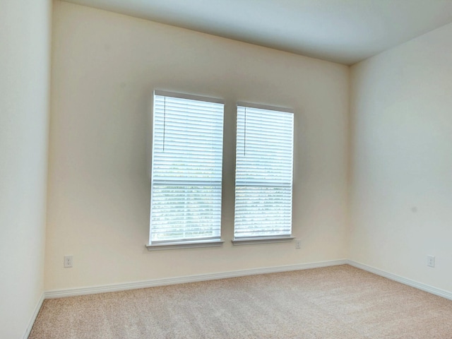 empty room with light colored carpet