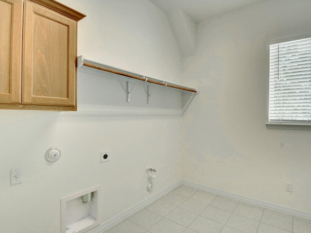 washroom featuring hookup for a gas dryer, hookup for an electric dryer, and cabinets