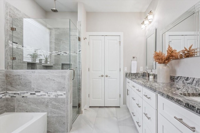 bathroom featuring vanity and plus walk in shower