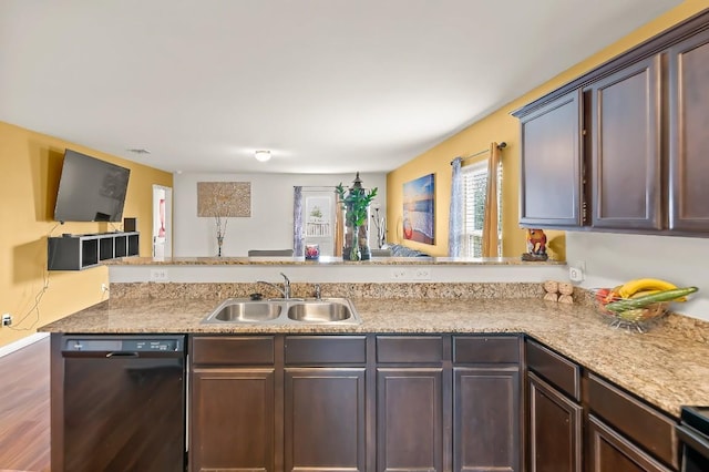 4004 Cressler Ln Unit 10F, Jarrell, TX 76537 - kitchen with dishwasher, a peninsula, dark brown cabinetry, and open floor plan