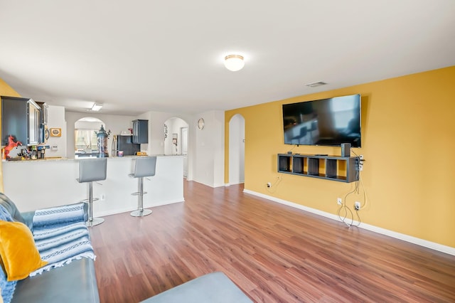 living room with dark wood-type flooring