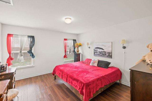 bedroom featuring dark wood-type flooring