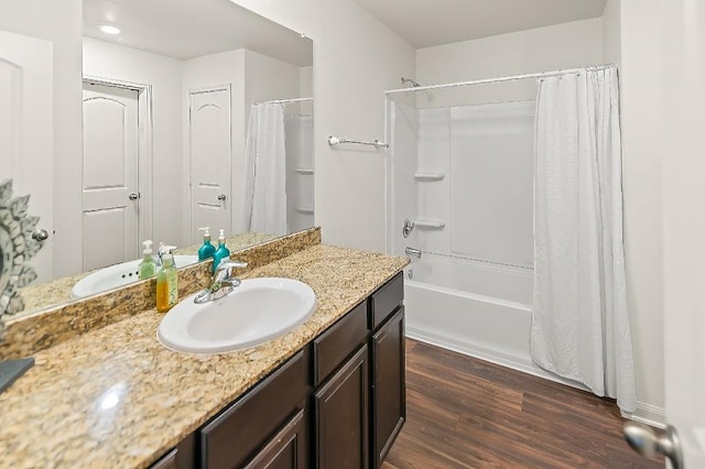 4004 Cressler Ln Unit 10F, Jarrell, TX 76537 - bathroom with vanity, wood finished floors, and shower / tub combo with curtain