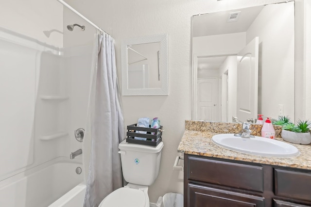 full bathroom featuring shower / bath combo with shower curtain, toilet, and vanity