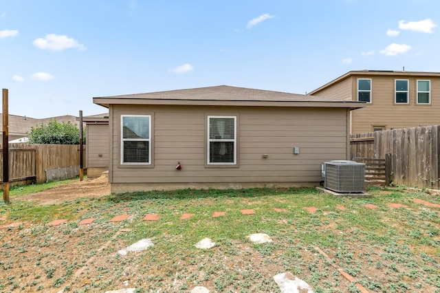 rear view of house with cooling unit