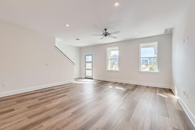 unfurnished room with light hardwood / wood-style flooring and ceiling fan