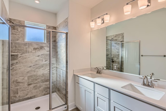 bathroom with an enclosed shower and vanity