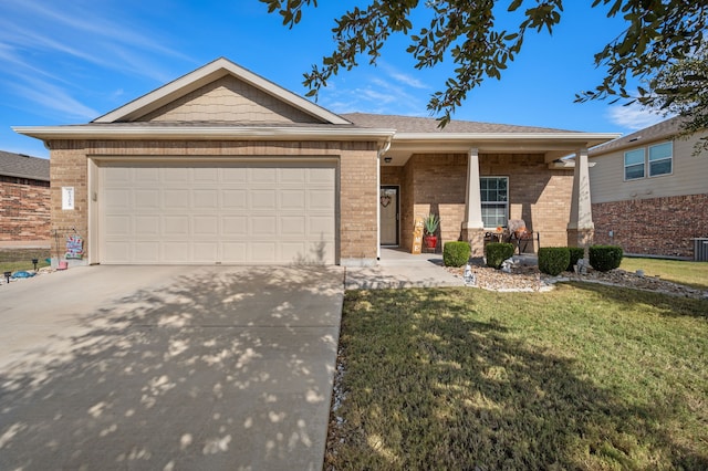 single story home featuring a garage and a front yard