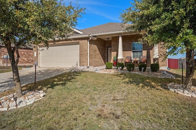 view of front of home with a garage, a front yard, and a porch