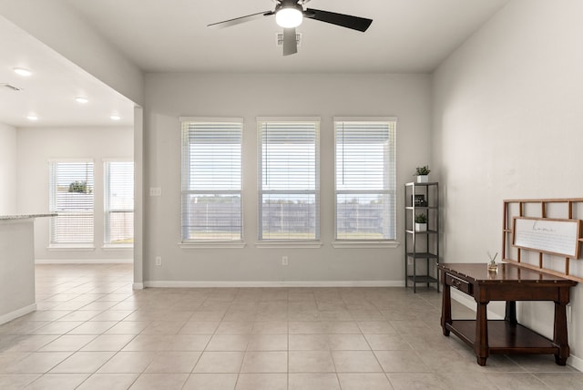 interior space featuring ceiling fan