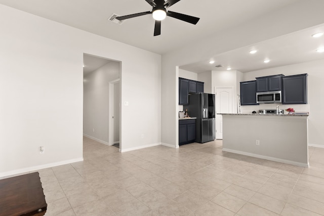 unfurnished living room with ceiling fan and light tile patterned flooring