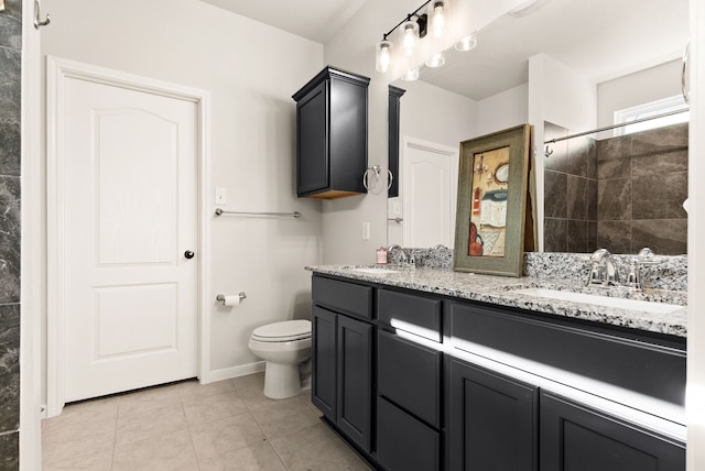 bathroom with tile patterned floors, vanity, toilet, and walk in shower