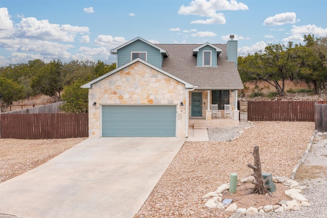 view of front of home featuring a garage and covered porch