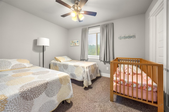 bedroom with ceiling fan and carpet flooring