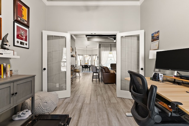 office area with ornamental molding, light wood-type flooring, and french doors