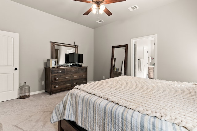 bedroom featuring light colored carpet, connected bathroom, and ceiling fan