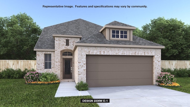 view of front of home with a garage, an outbuilding, and a front lawn