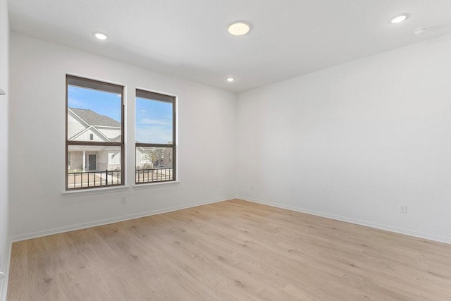 unfurnished room featuring light wood-type flooring