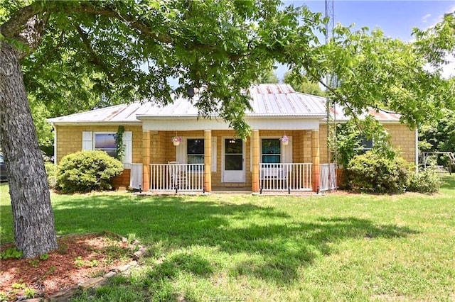 view of front of house featuring a front yard and a porch