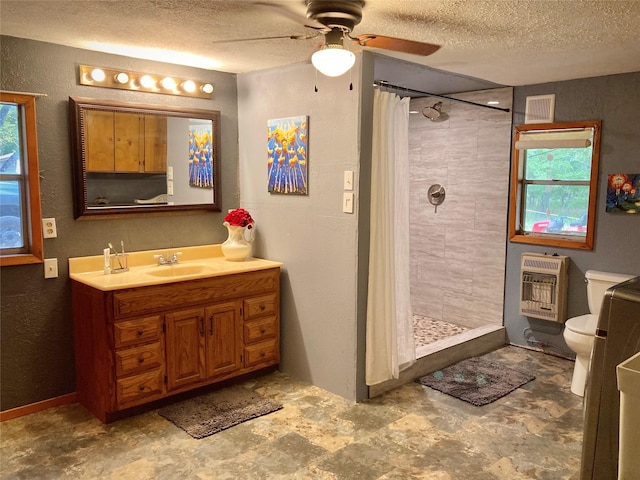 bathroom with a textured ceiling, toilet, heating unit, walk in shower, and vanity