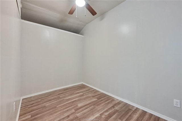 spare room featuring ceiling fan, hardwood / wood-style floors, and lofted ceiling