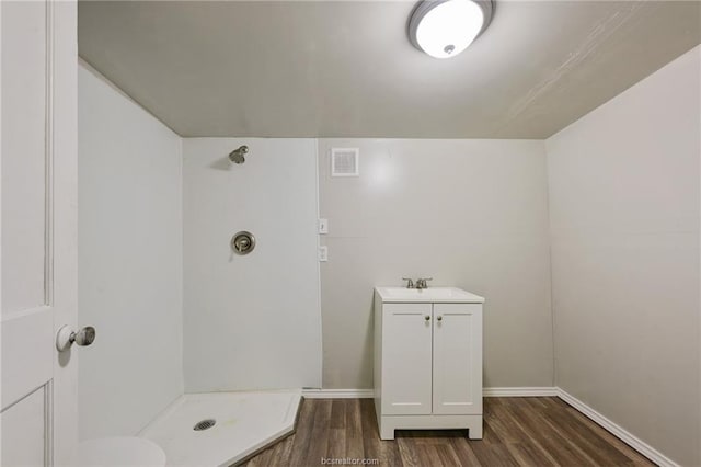 bathroom with hardwood / wood-style flooring and vanity