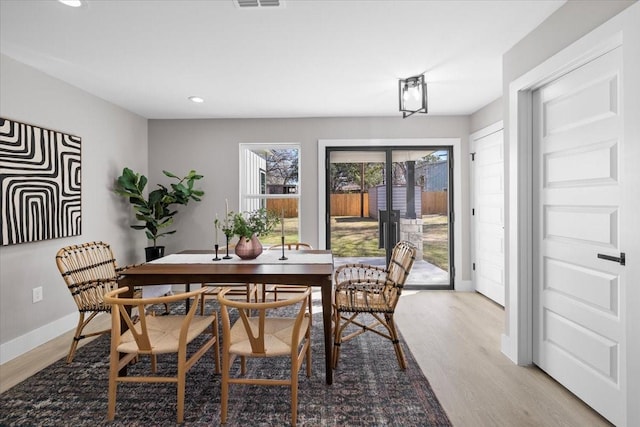 dining room featuring light hardwood / wood-style floors