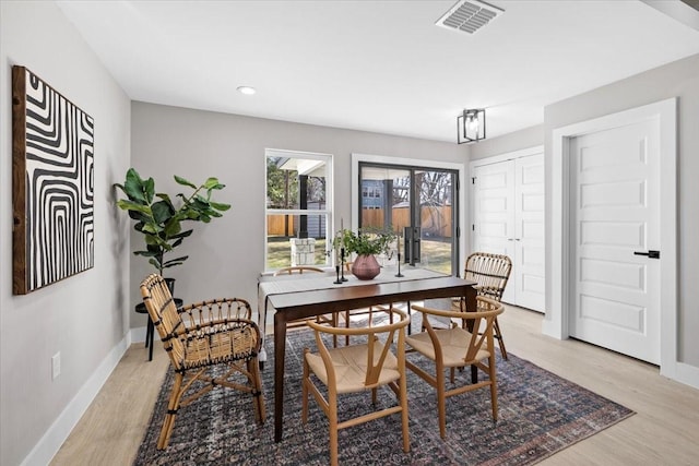 dining room with light wood-type flooring