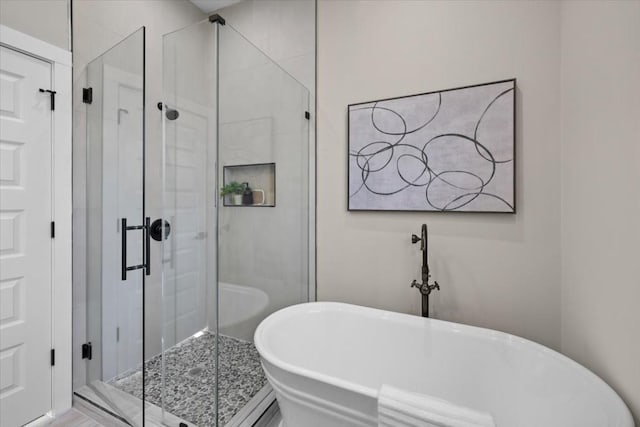 6003 Libyan Dr, Austin, TX 78745 - bathroom featuring a freestanding tub and a stall shower
