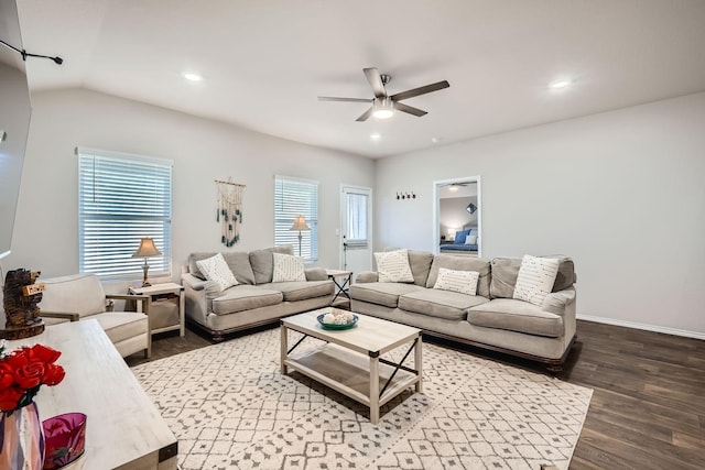 living room with wood-type flooring, vaulted ceiling, and ceiling fan