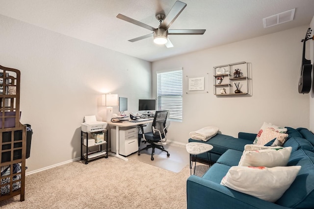 office area featuring light carpet and ceiling fan