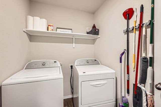 washroom featuring hardwood / wood-style floors and washer and clothes dryer